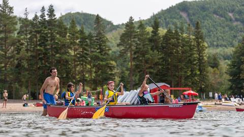 a group of people in a canoe